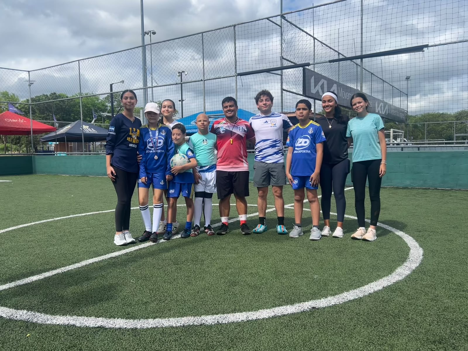 Coaches and children celebrating